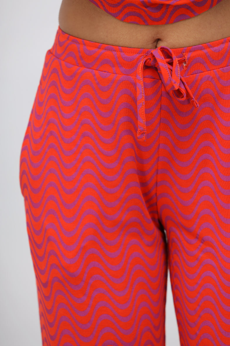 Orange wavy soft modal pajama pants with a stylish pattern.