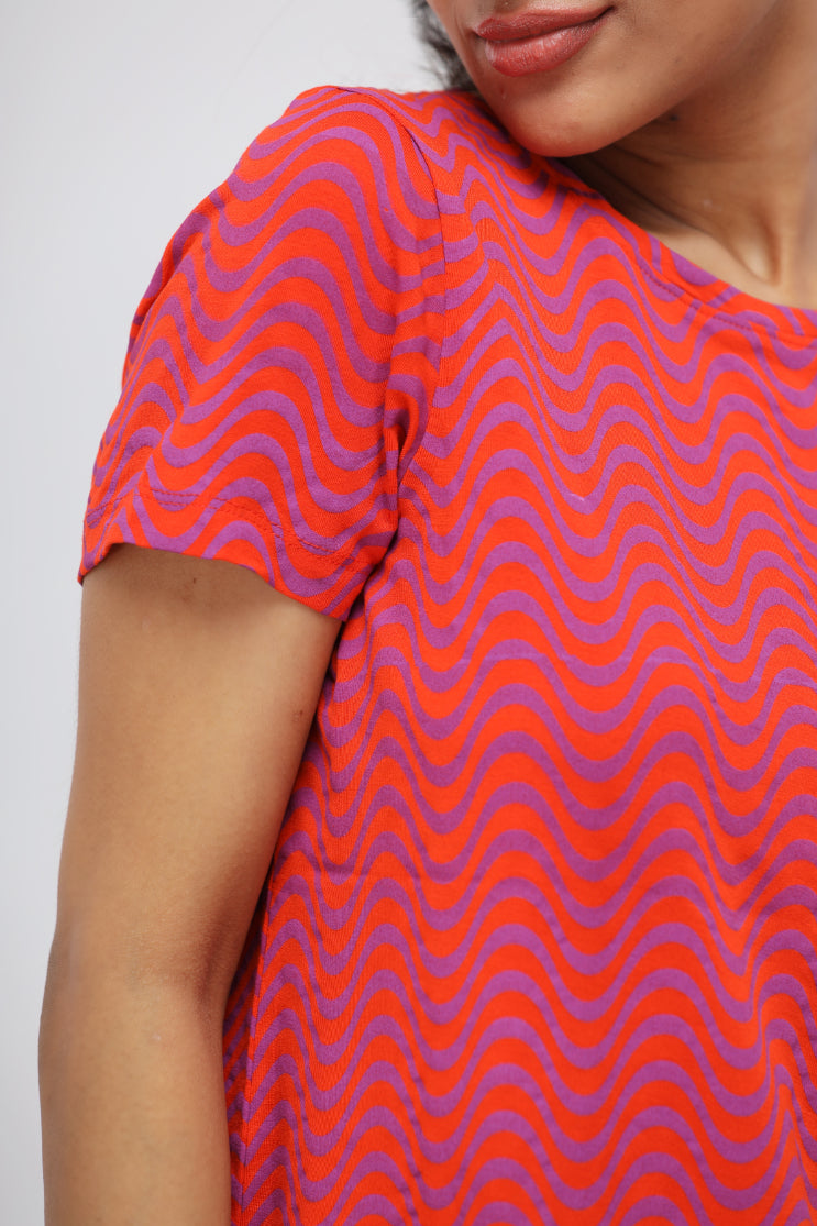 Orange wavy soft modal top with purple wave design for women.