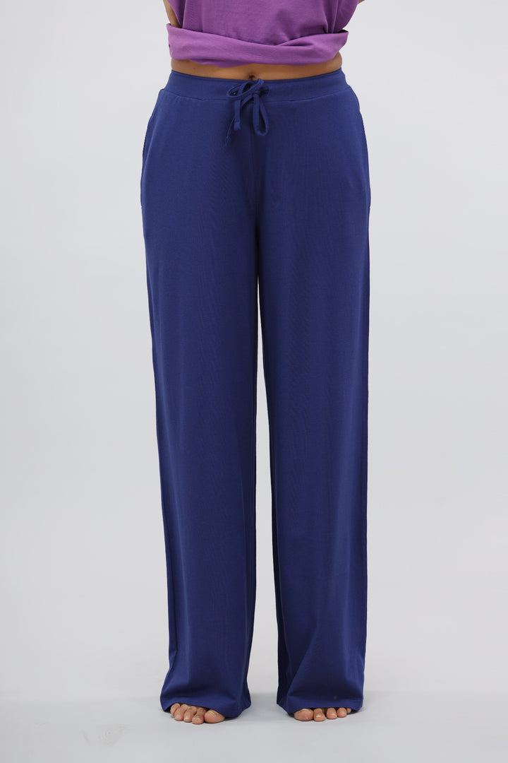 Functional blue Supima® flared lounge pant styled for comfort and versatility.
