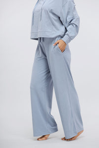 Dusty blue Luxflo travel pants for comfortable and stylish wear.