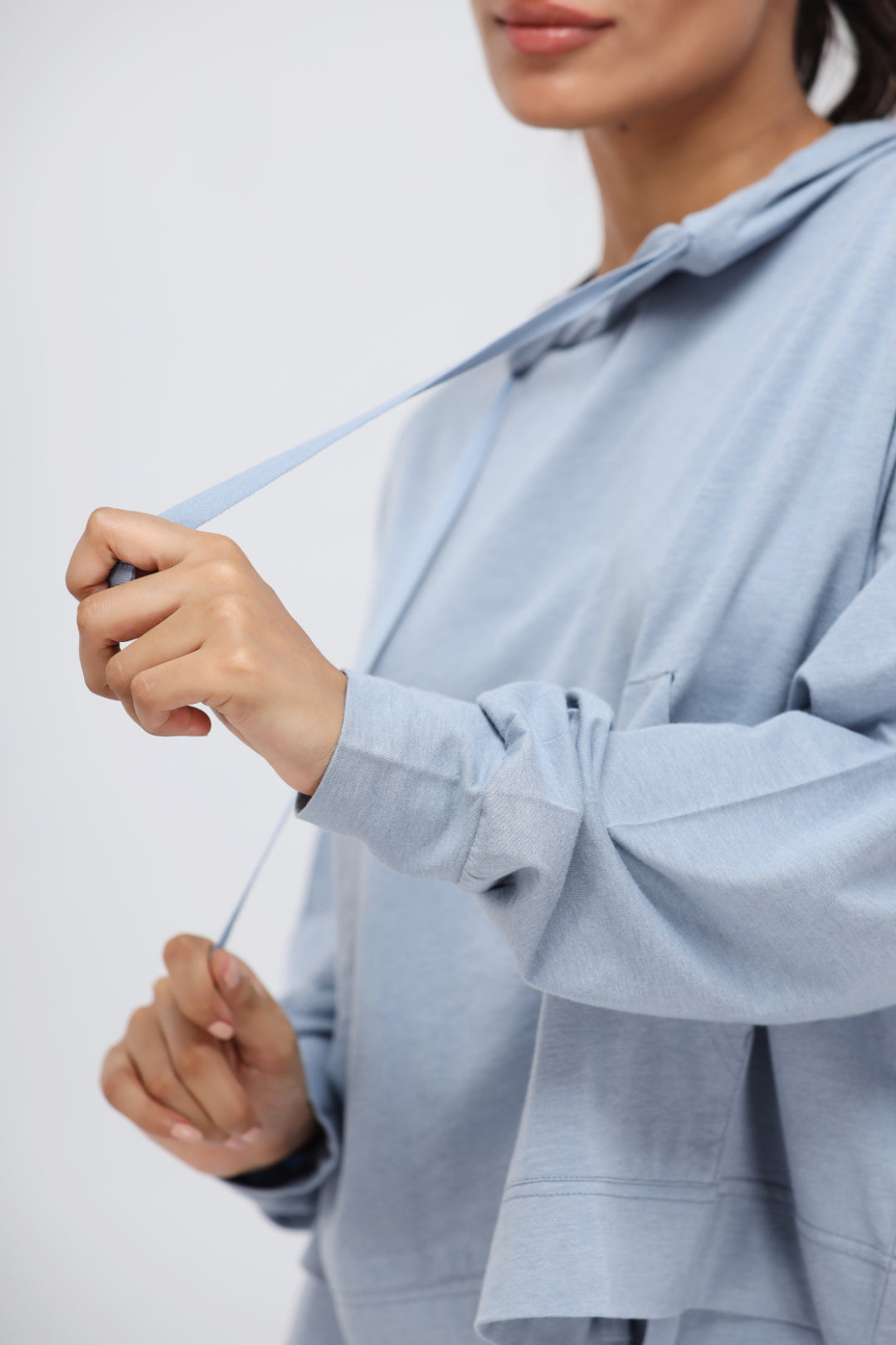 Dusty Blue Luxflo Travel Hoodie with adjustable drawstring detail.