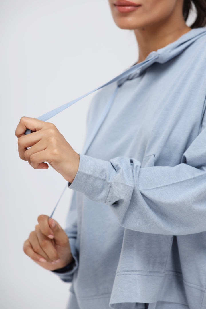 Dusty Blue Luxflo Travel Hoodie with adjustable drawstring detail.