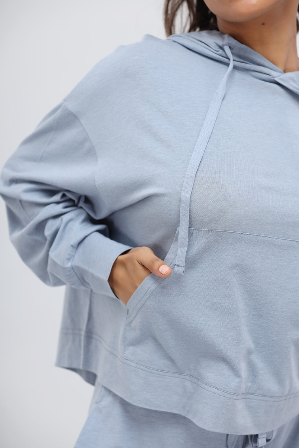Dusty blue Luxflo travel hoodie with cozy pockets and relaxed fit.