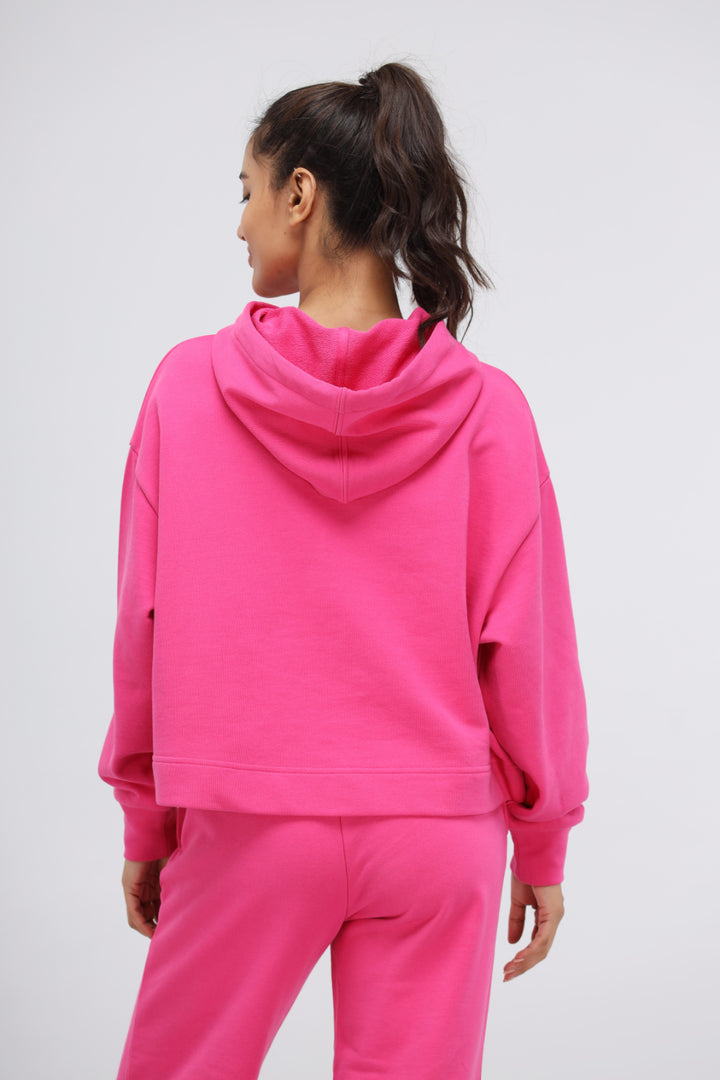 Back view of pink cotton terry hoodie set for women.