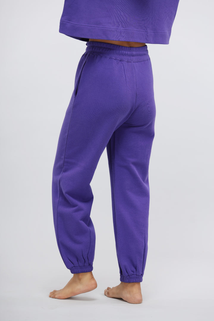 Deep Blue Terry Relaxed Jogger in vibrant purple color, showcasing comfort and style.