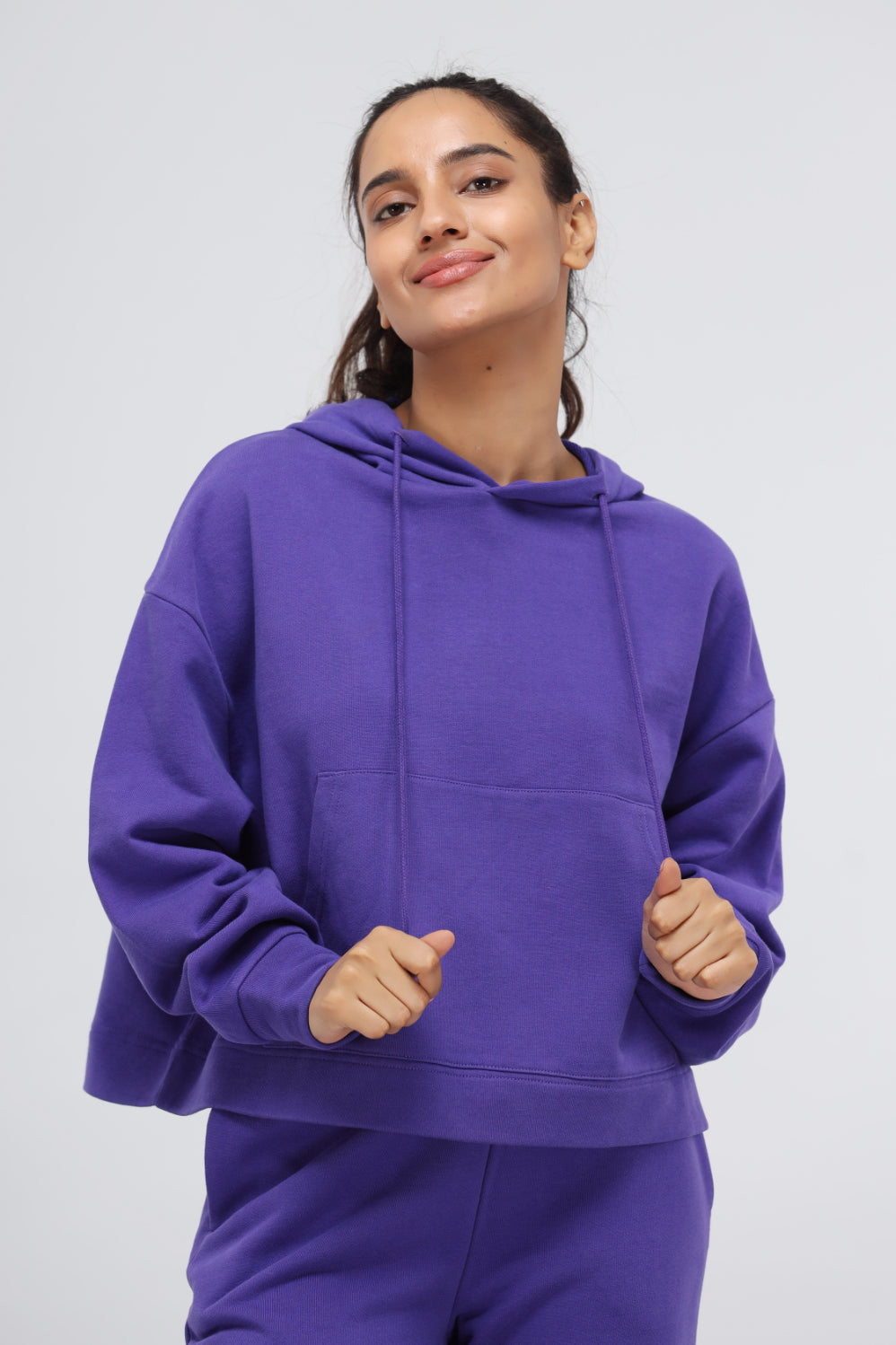 Deep Blue Terry Hoodie Set in purple, model showcasing casual style.