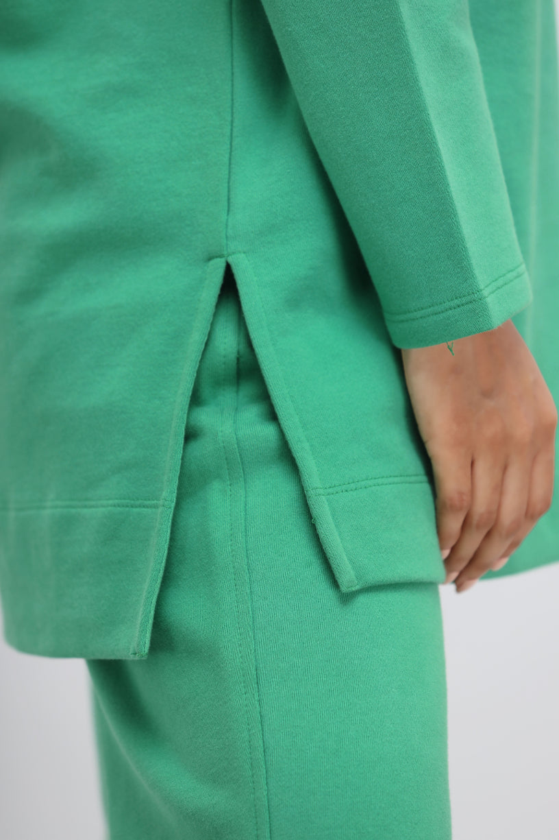 Green Bee Terry Long Pullover close-up showing stylish design and fabric details.