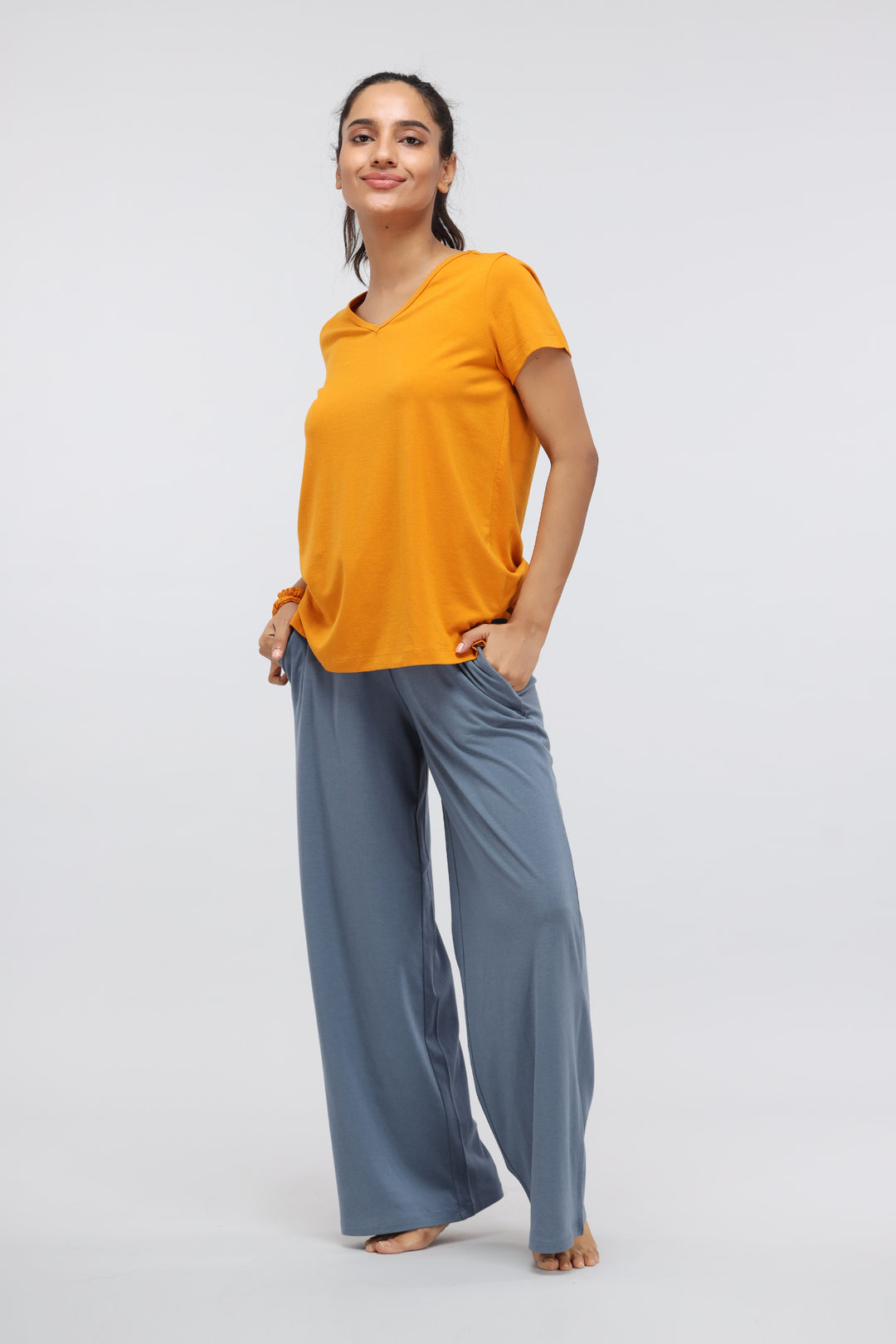 Model wearing China Blue Supima® Flared Lounge Pant with orange top.