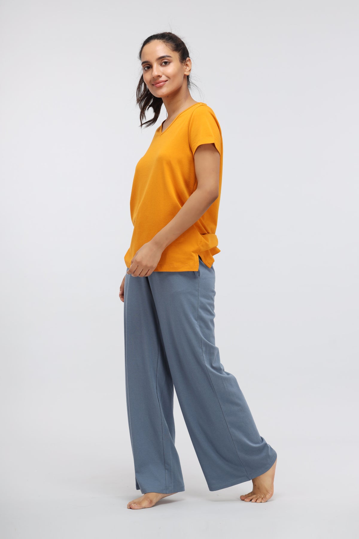 China Blue Supima® flared lounge pant styled with an orange t-shirt.