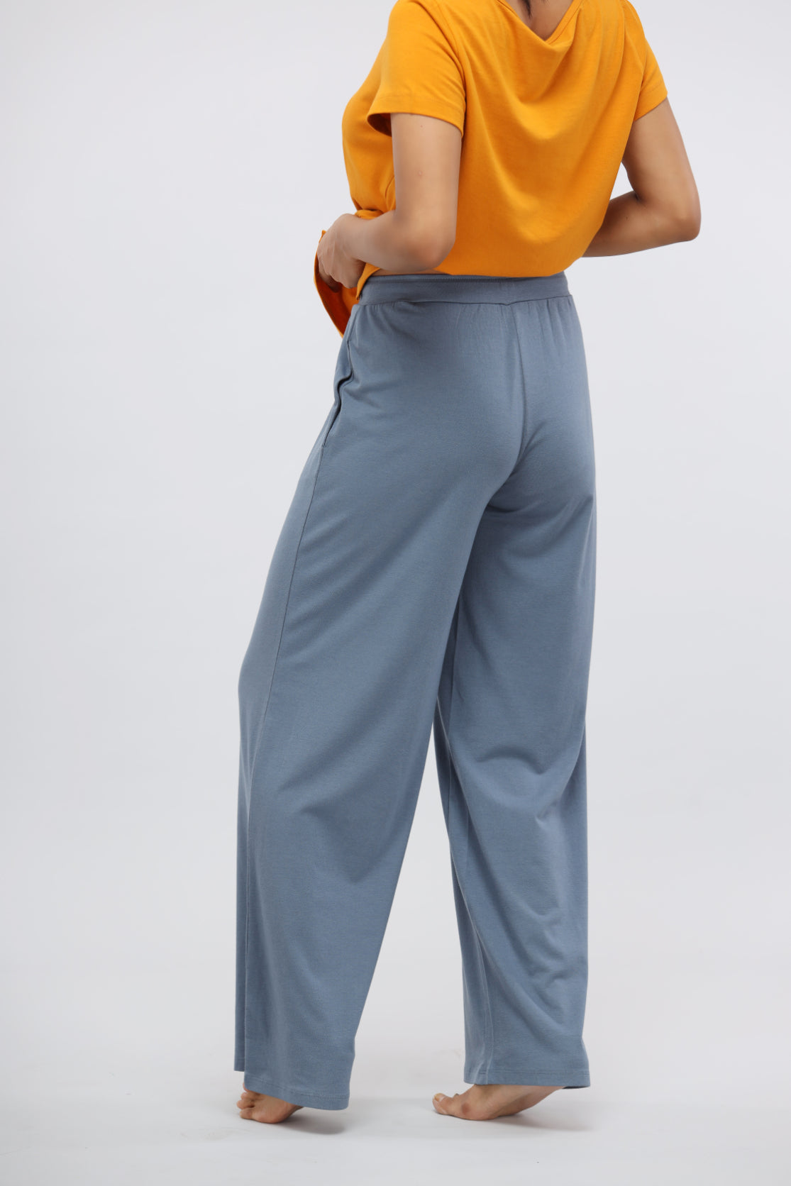 China Blue Supima® Flared Lounge Pant worn with an orange top.
