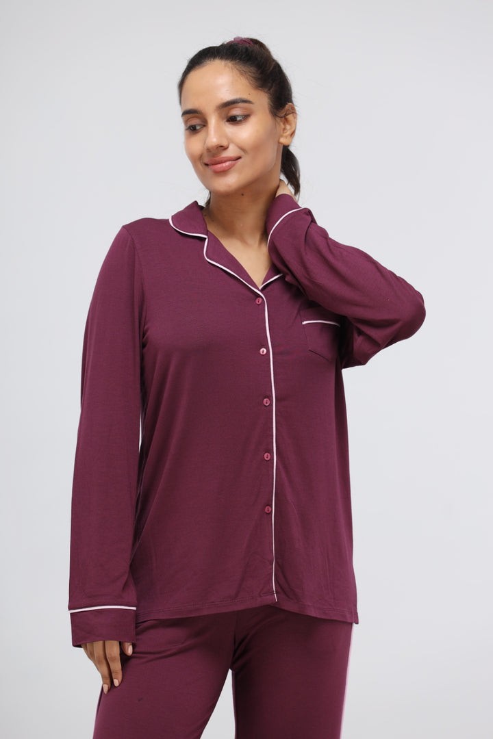 Wine modal full sleeve top with piping detail for women.