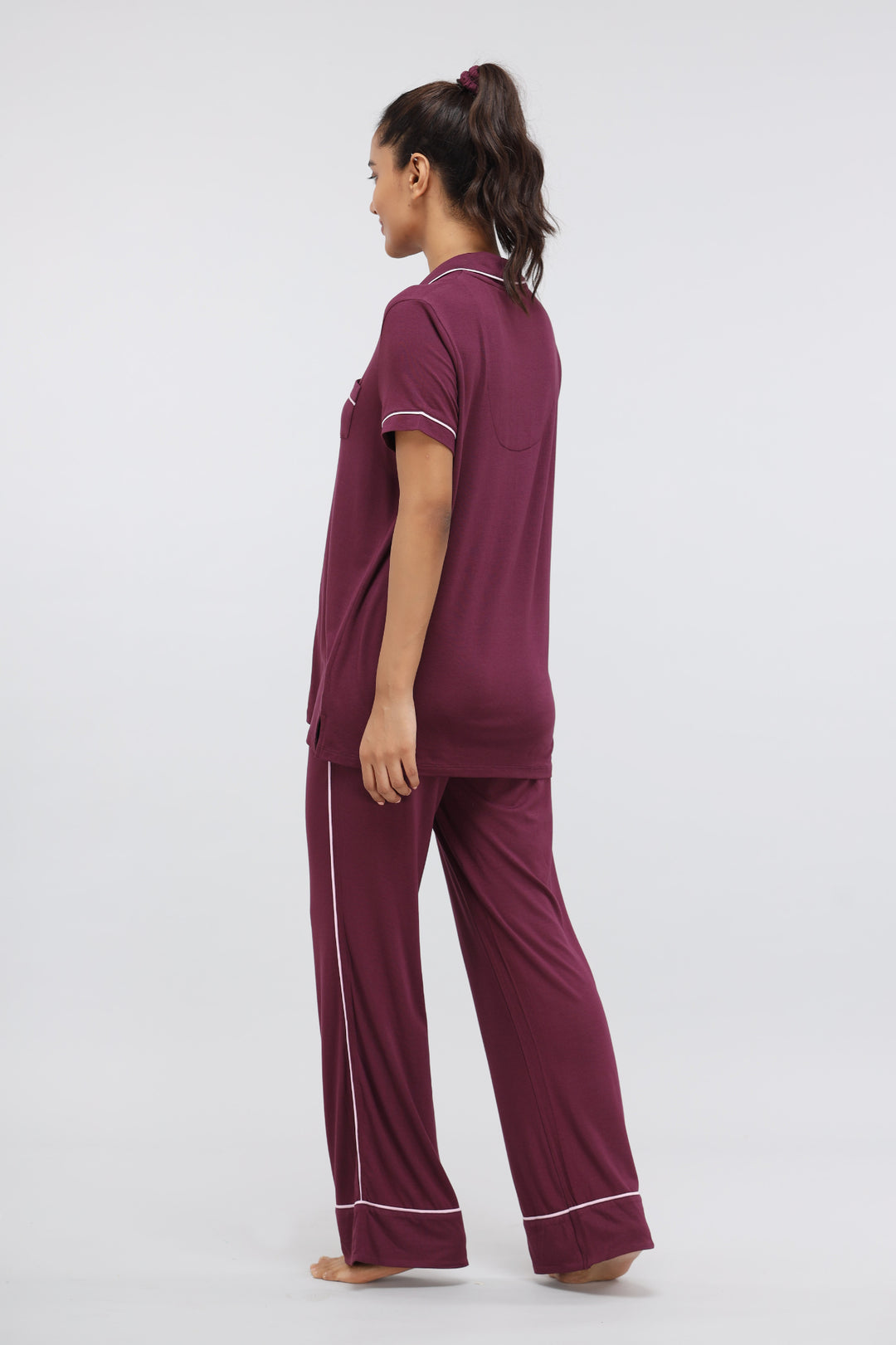 Wine modal pajama set with button-down top and piping details.