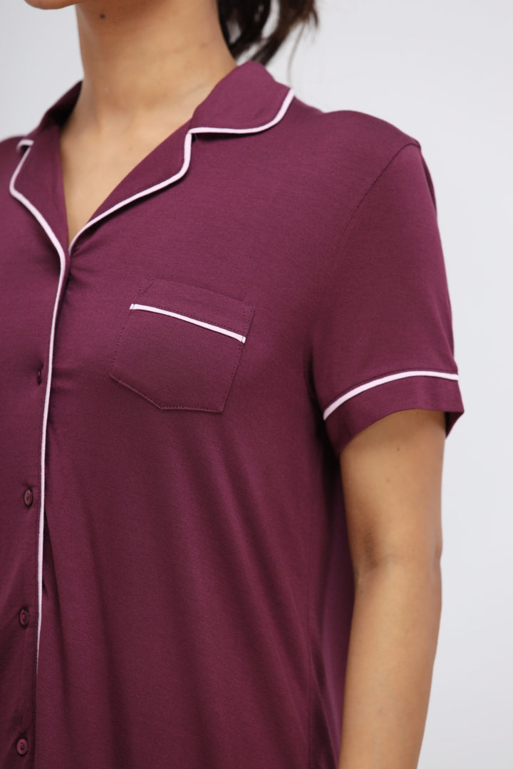 Wine modal piping half sleeve top with pocket detail.