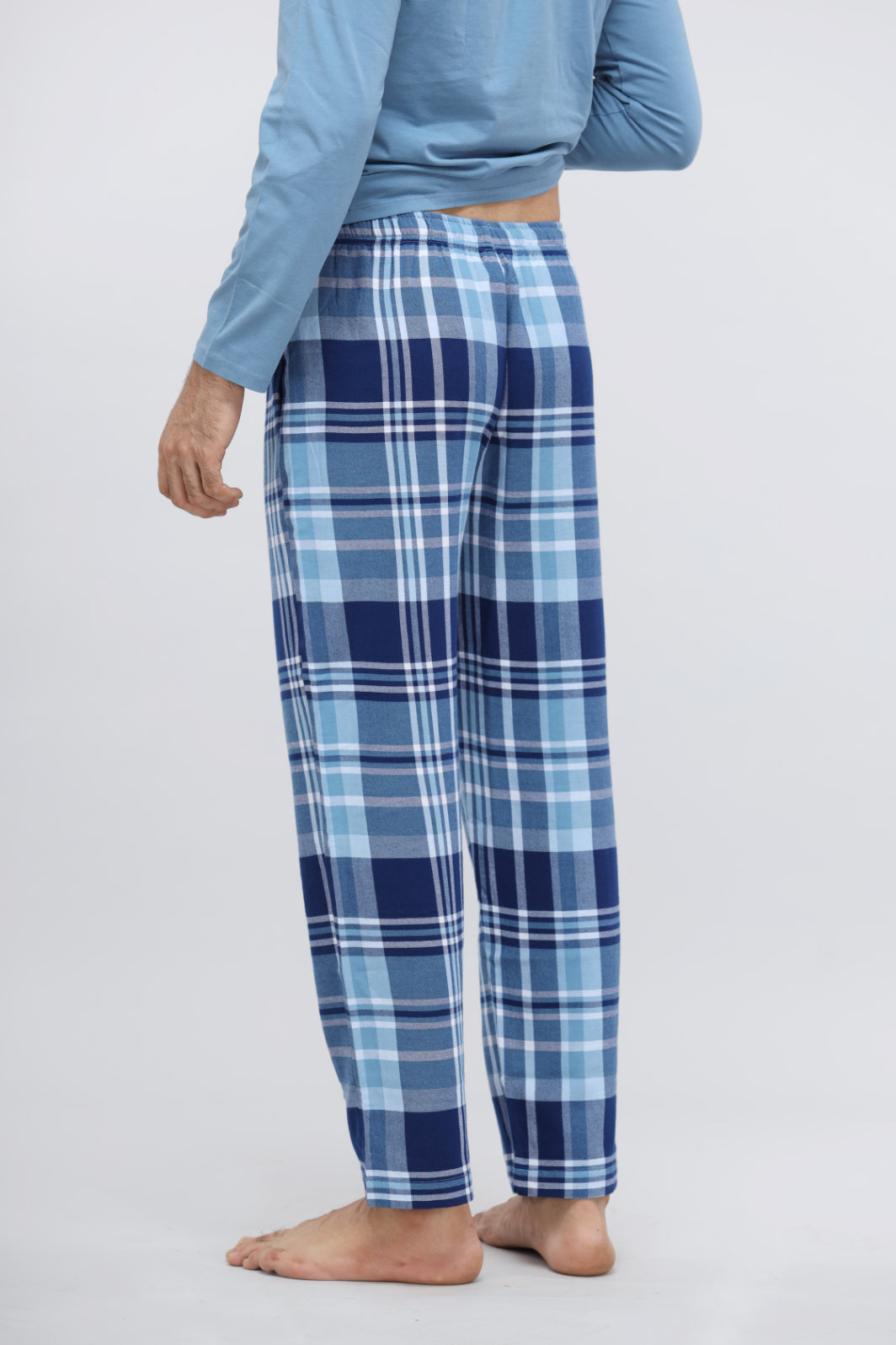Men's plaid flannel pajama set in blue and navy tones.