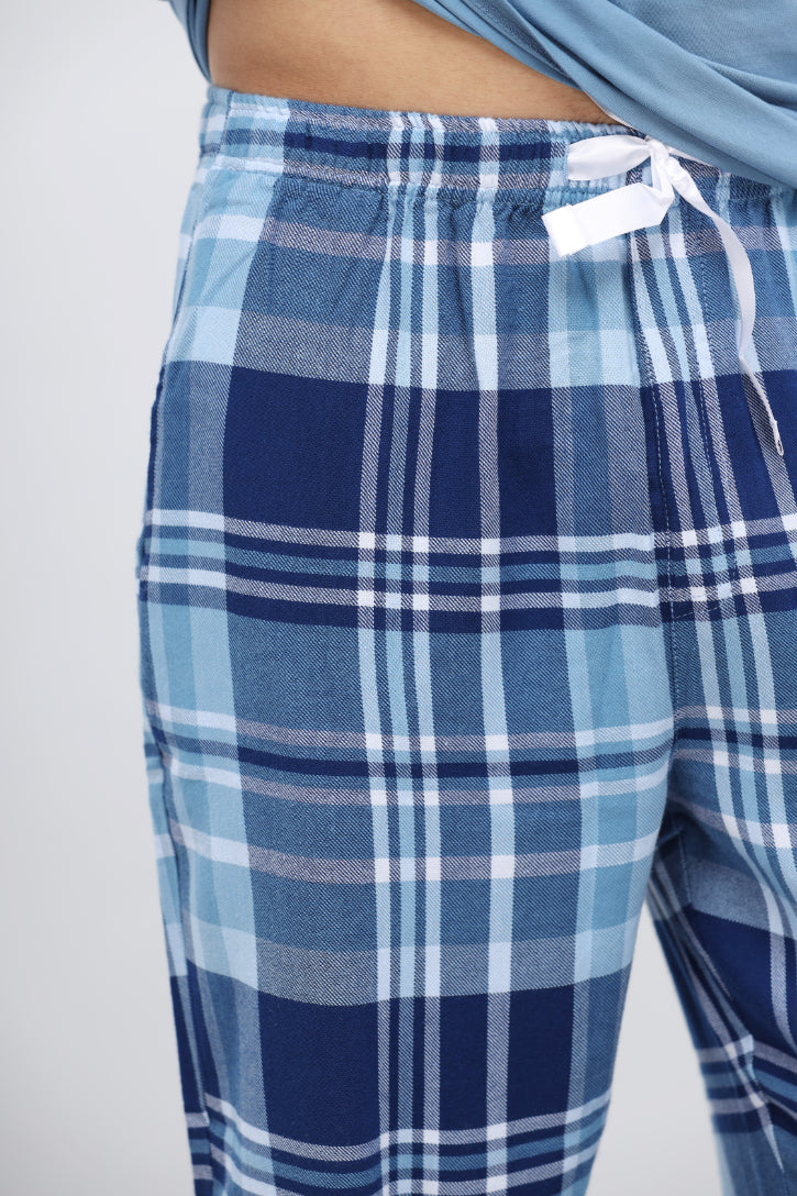 Men's plaid flannel pajamas with blue and navy checkered pattern.