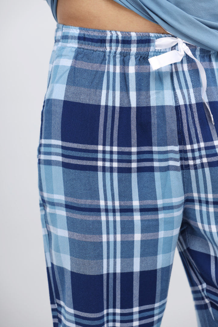 Men's plaid flannel pajamas with blue and navy checkered pattern.