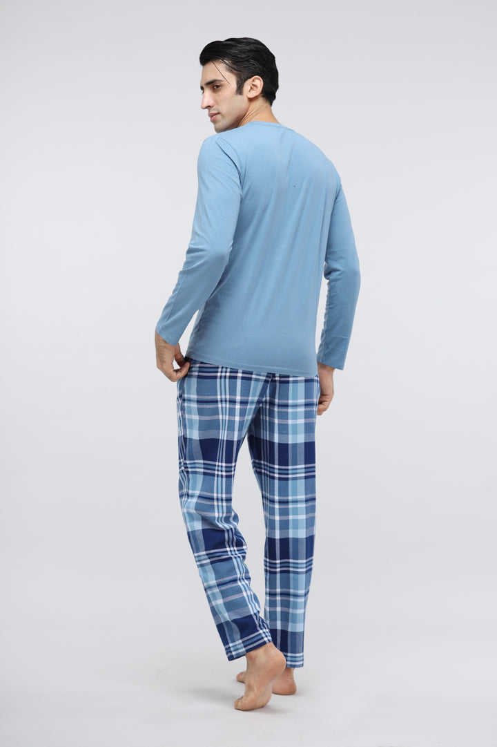 Men's plaid flannel pajama set model showcasing stylish comfort.