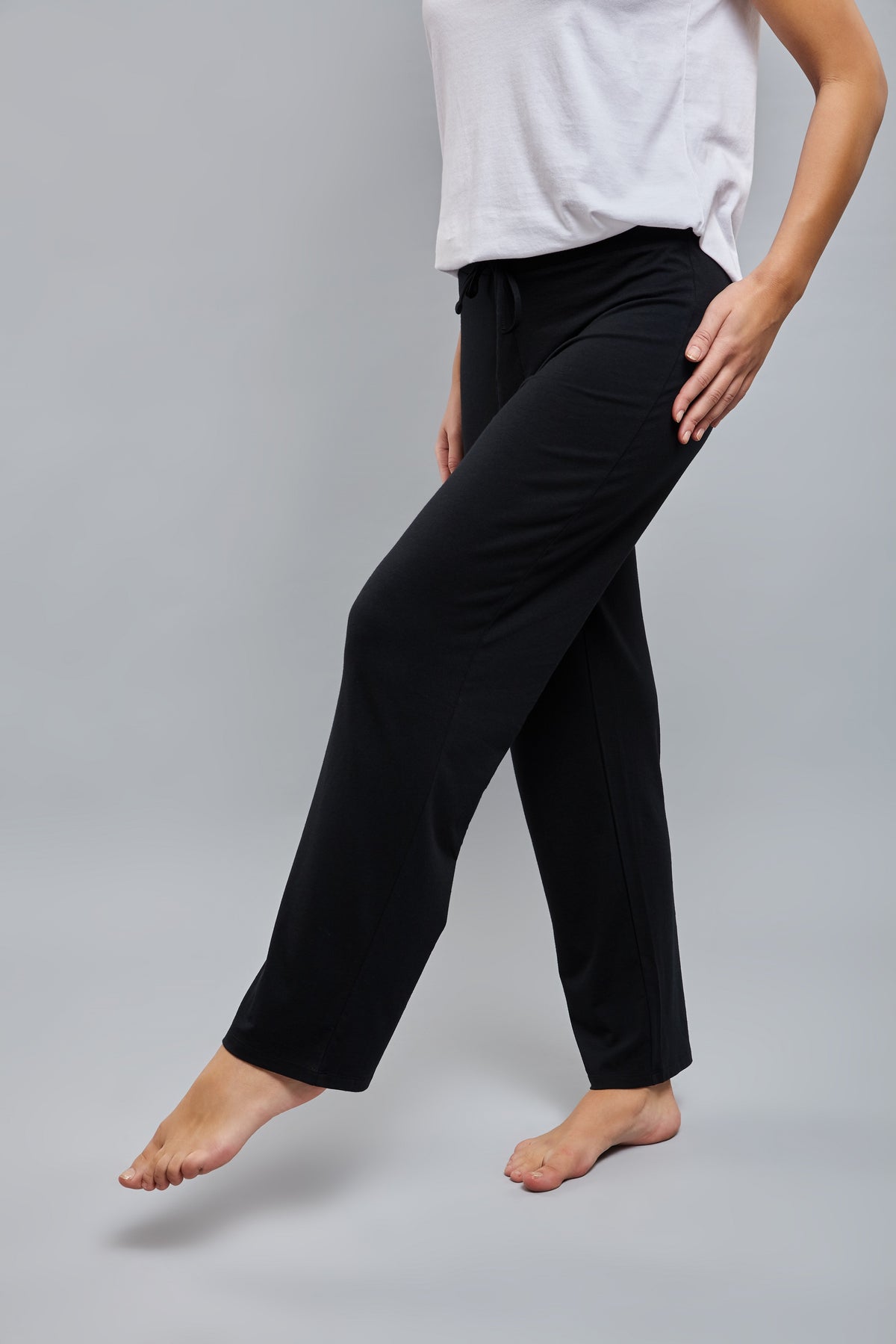 Model wearing Lazy Lounge Pajamas in black, showcasing comfort and style.