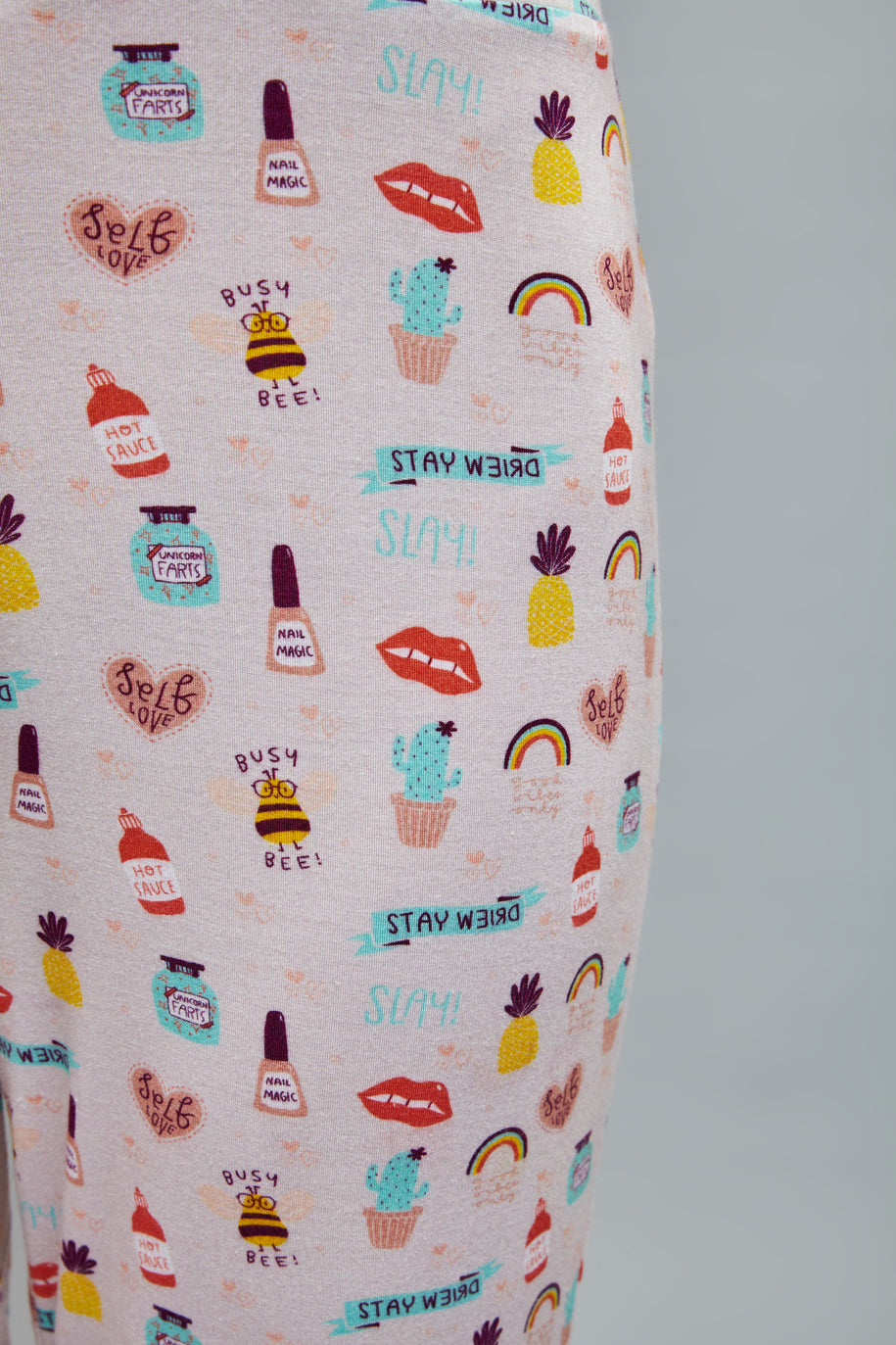 Colorful "Stay Weird Pajamas" with fun, quirky patterns and designs.
