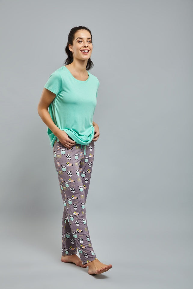 "Happy woman in Woke Up Like This Panda Pajamas, casual and comfy."