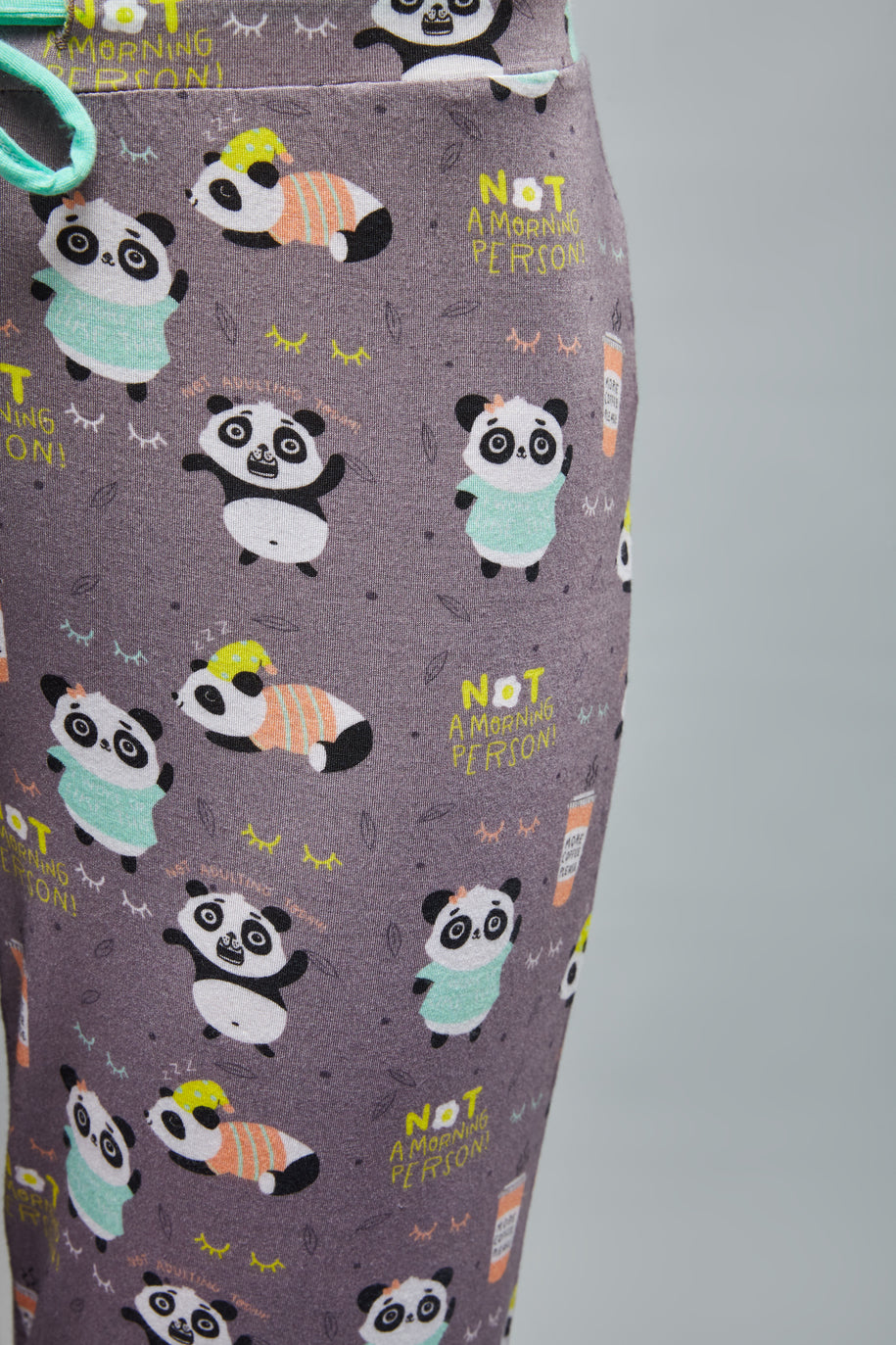 Cute panda print pajamas with "Not a Morning Person" slogan.
