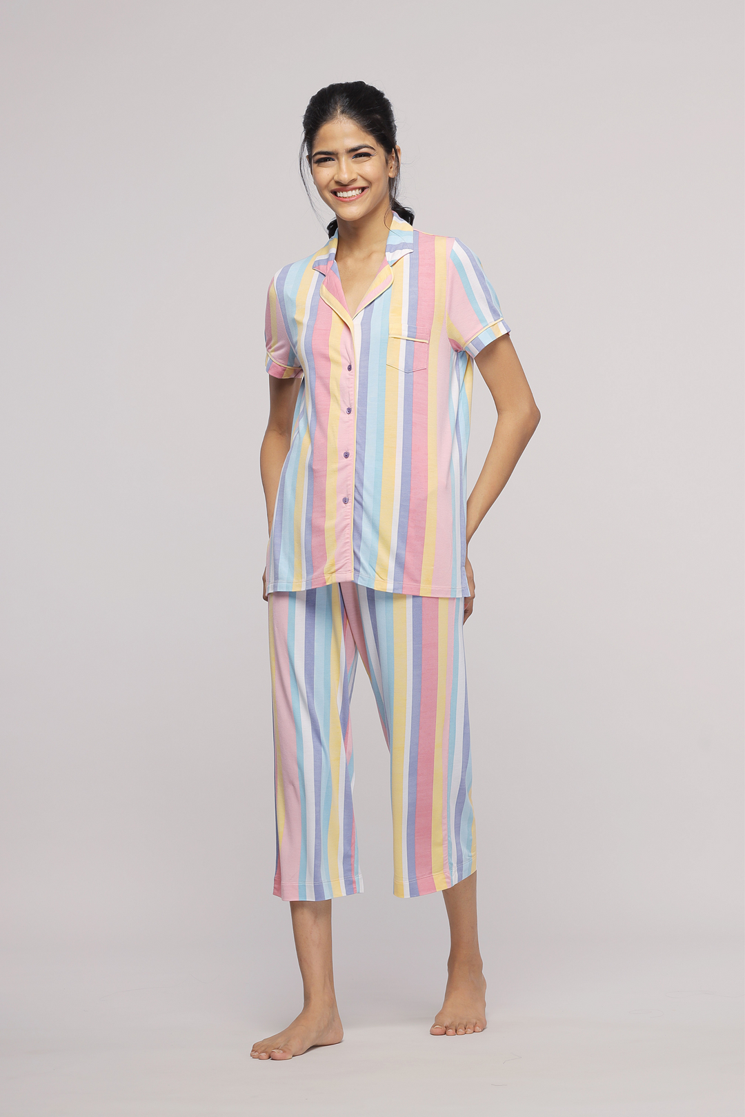 Pastel Stripe Capri Set worn by smiling model in bright colors.