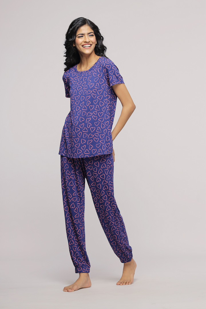 Sweetheart pajamas in purple with heart patterns, stylish and comfortable.