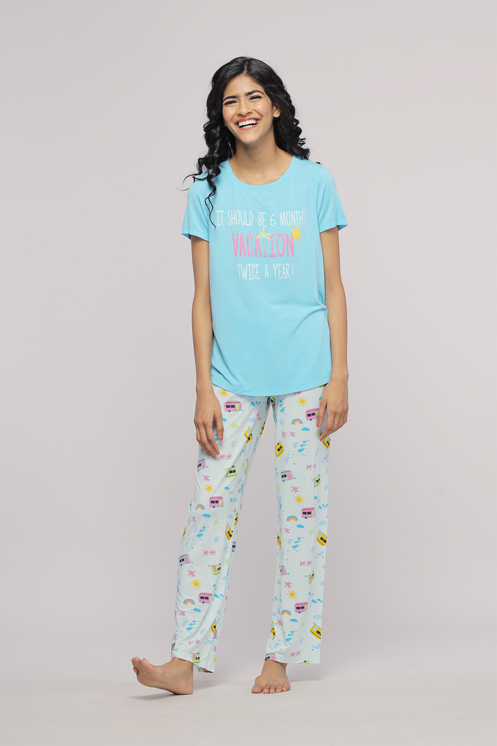 Light blue pajama set featuring vacation-themed graphics and playful text.