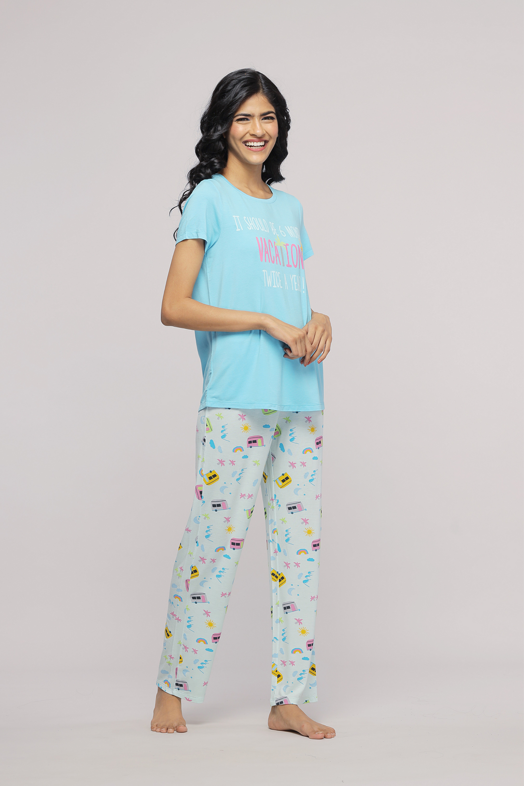 "Stylish women's pajama set featuring colorful vacation-themed prints."