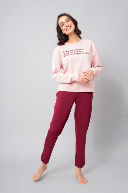 Happy People sweatshirt styled with pink and maroon loungewear.