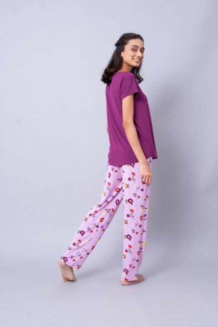 Winter Romance Pajama Set featuring floral patterned pants and a purple top.