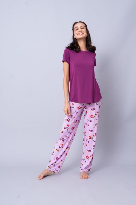 Winter Romance Pajama Set featuring floral print pants and a purple top.